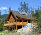 An off grid house with solar panels on the roof